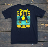 Black t-shirt with 'Fish and Grits Groves' graphic design on a wooden surface